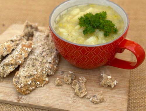 Leek and potato soup served with rustic homemade bread on the side